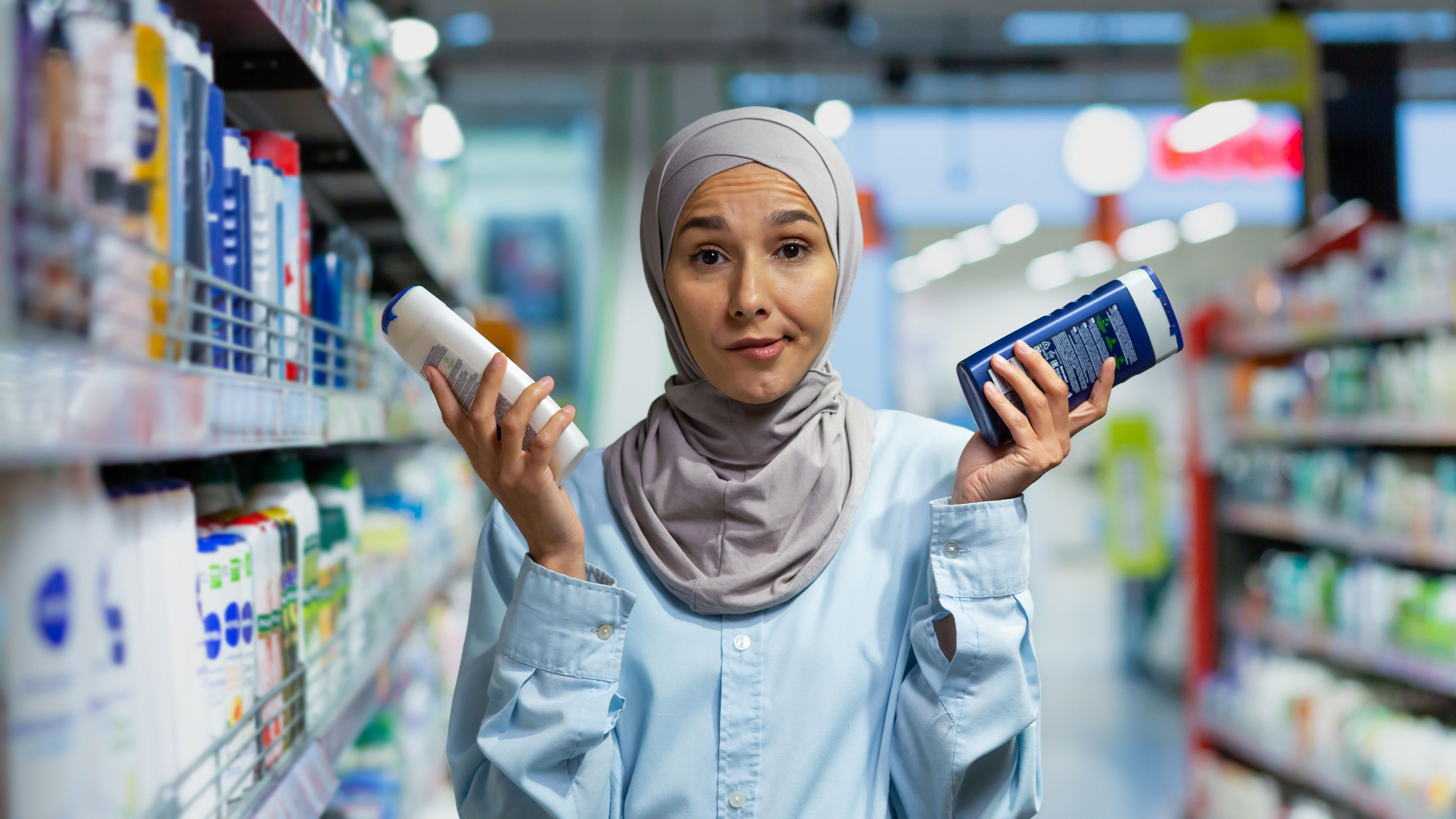 Muslim women selecting beauty products