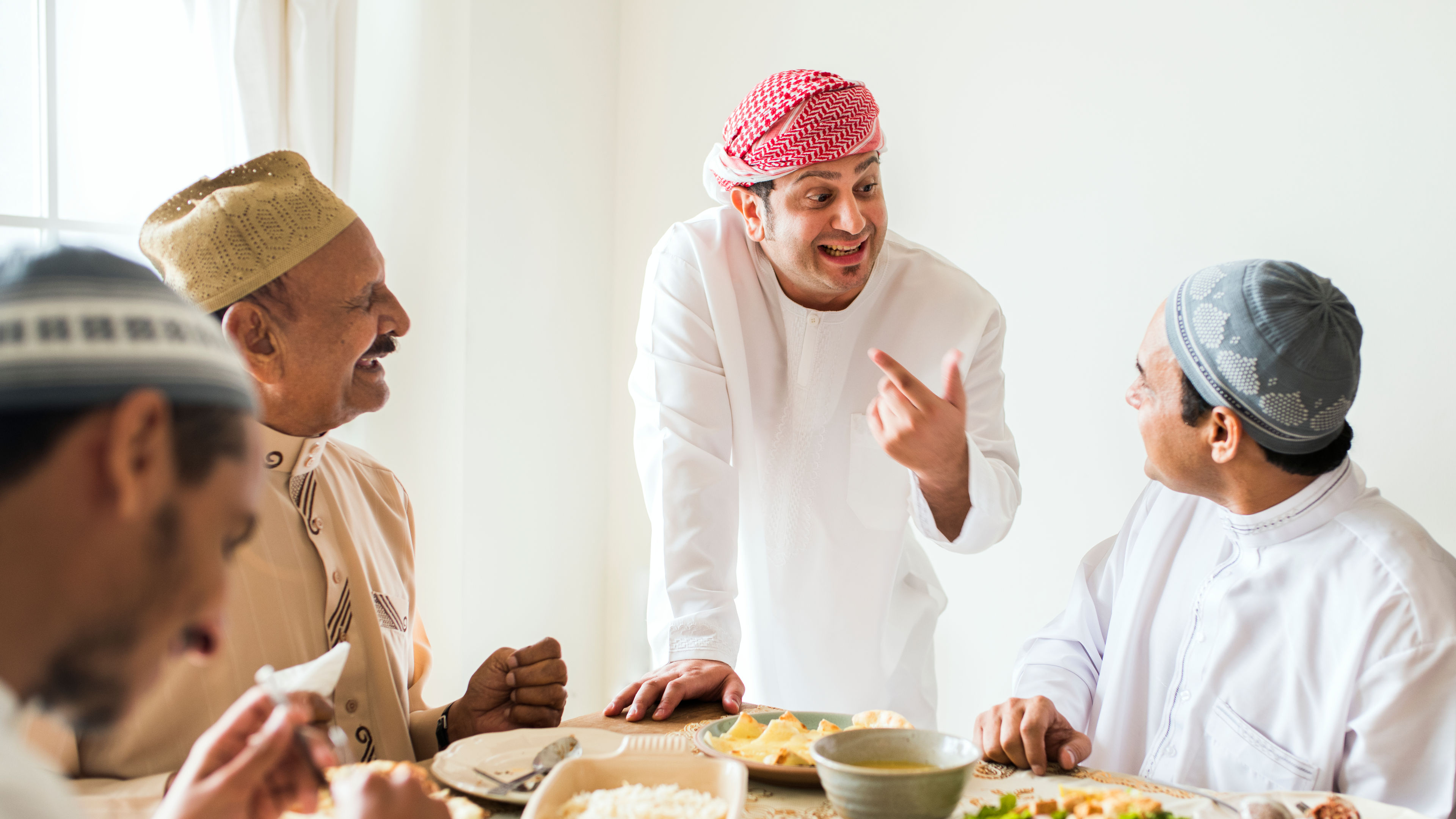 A group of men are enjoying a meal together