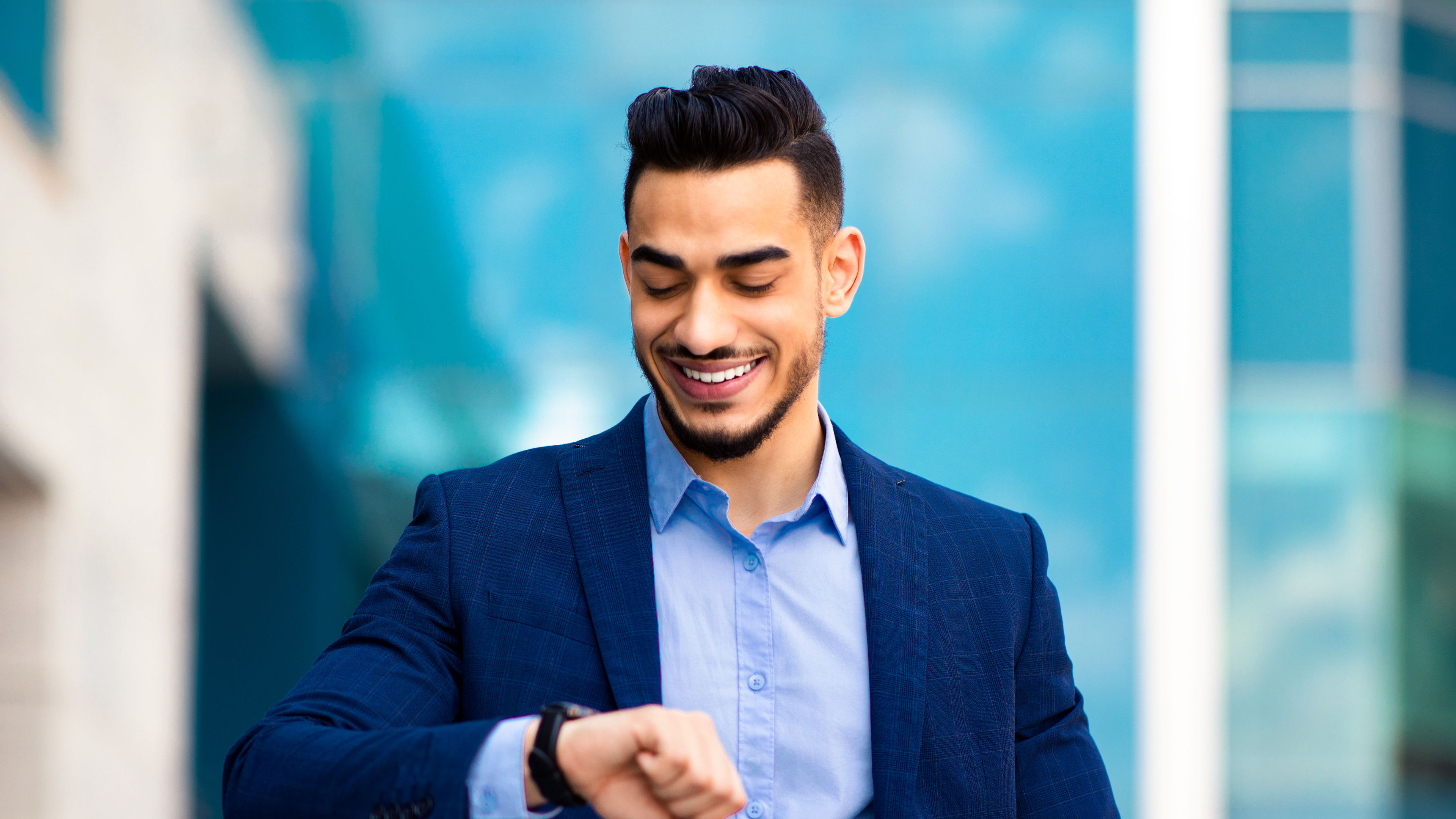 A man looking at his watch