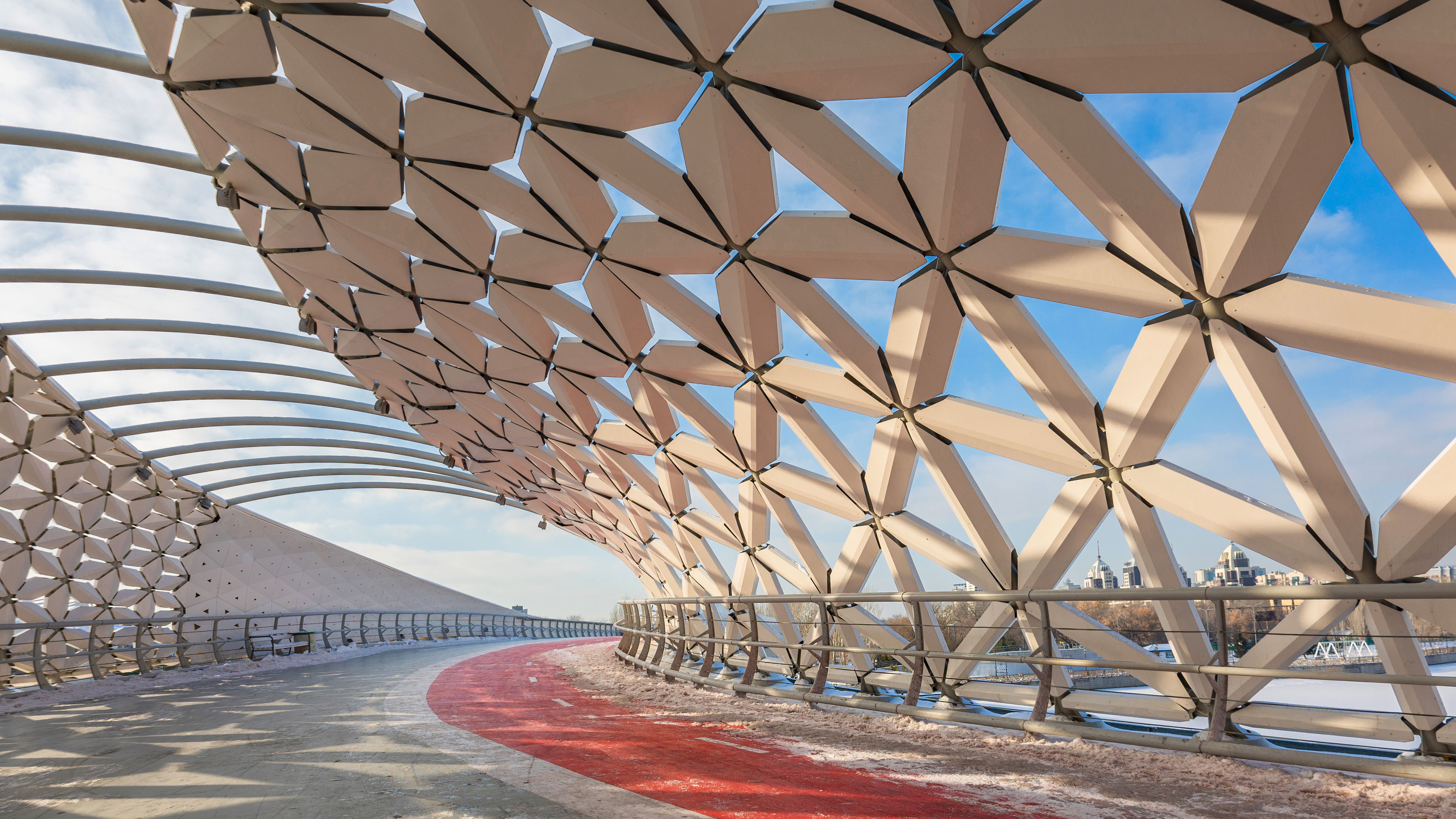 Modern architectural urbanistic Atyrau fish bridge across Ishim river
