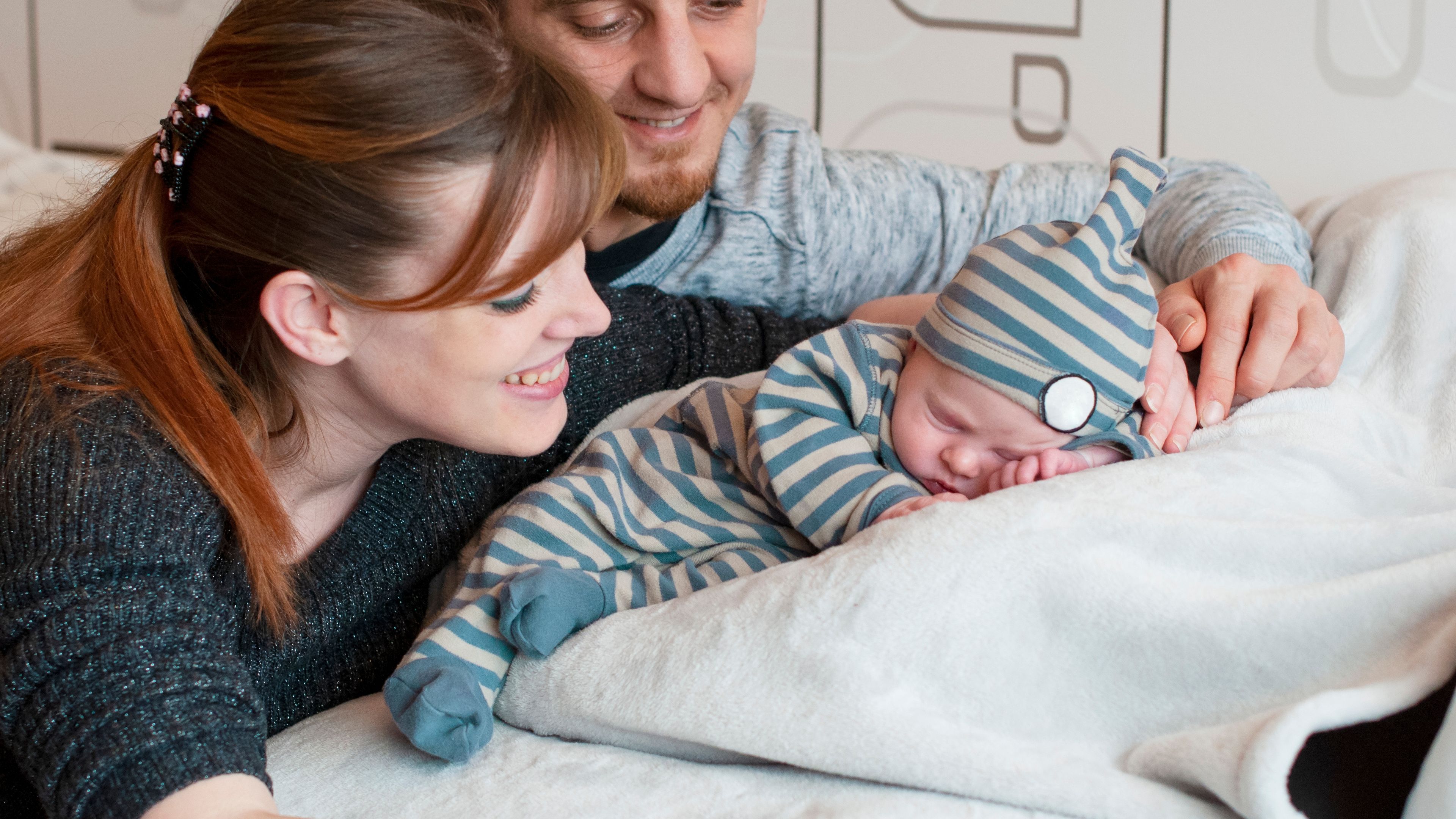Parents looking at the baby with love