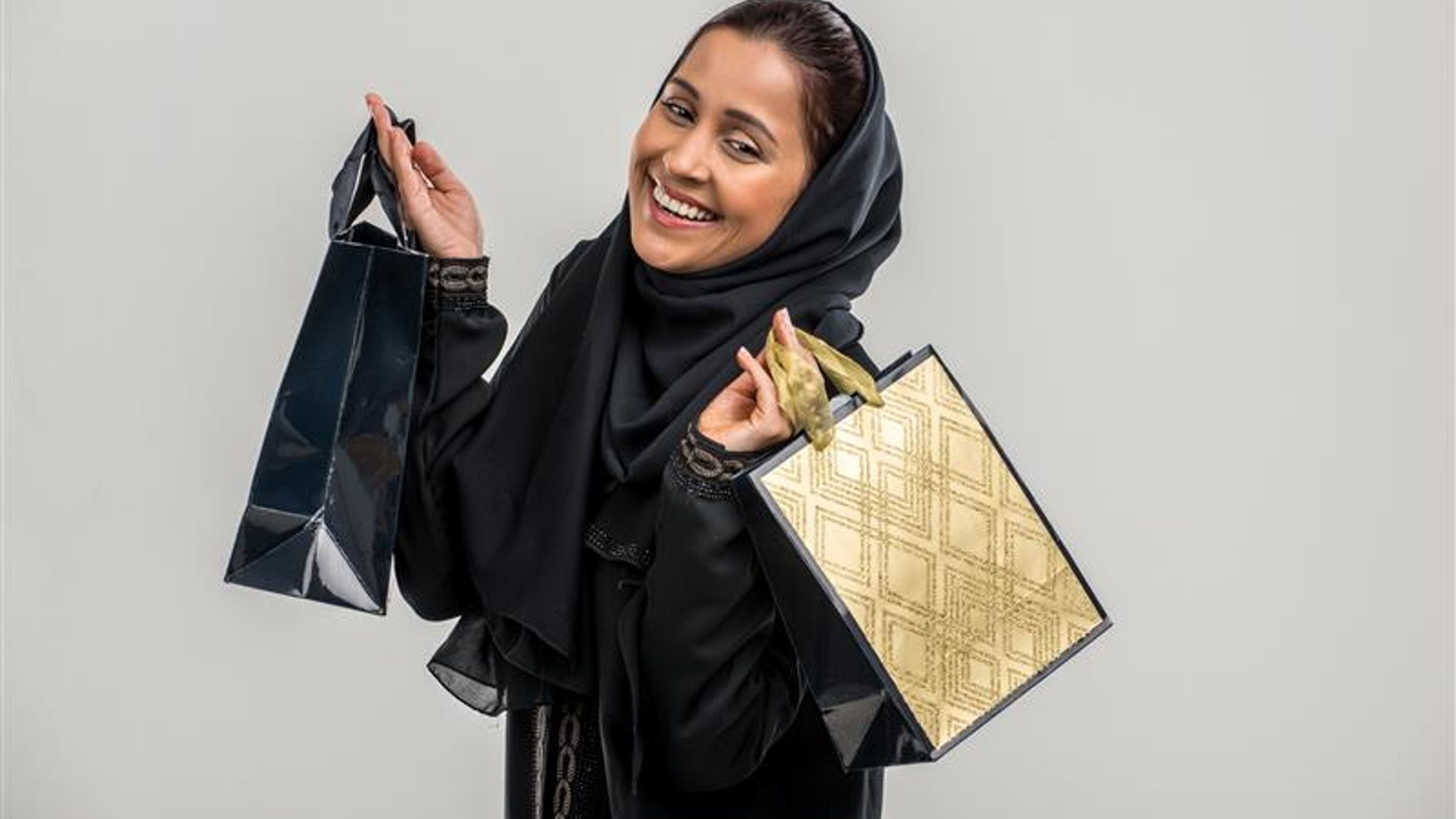 Portrait of arabic woman with traditional abaya dress  