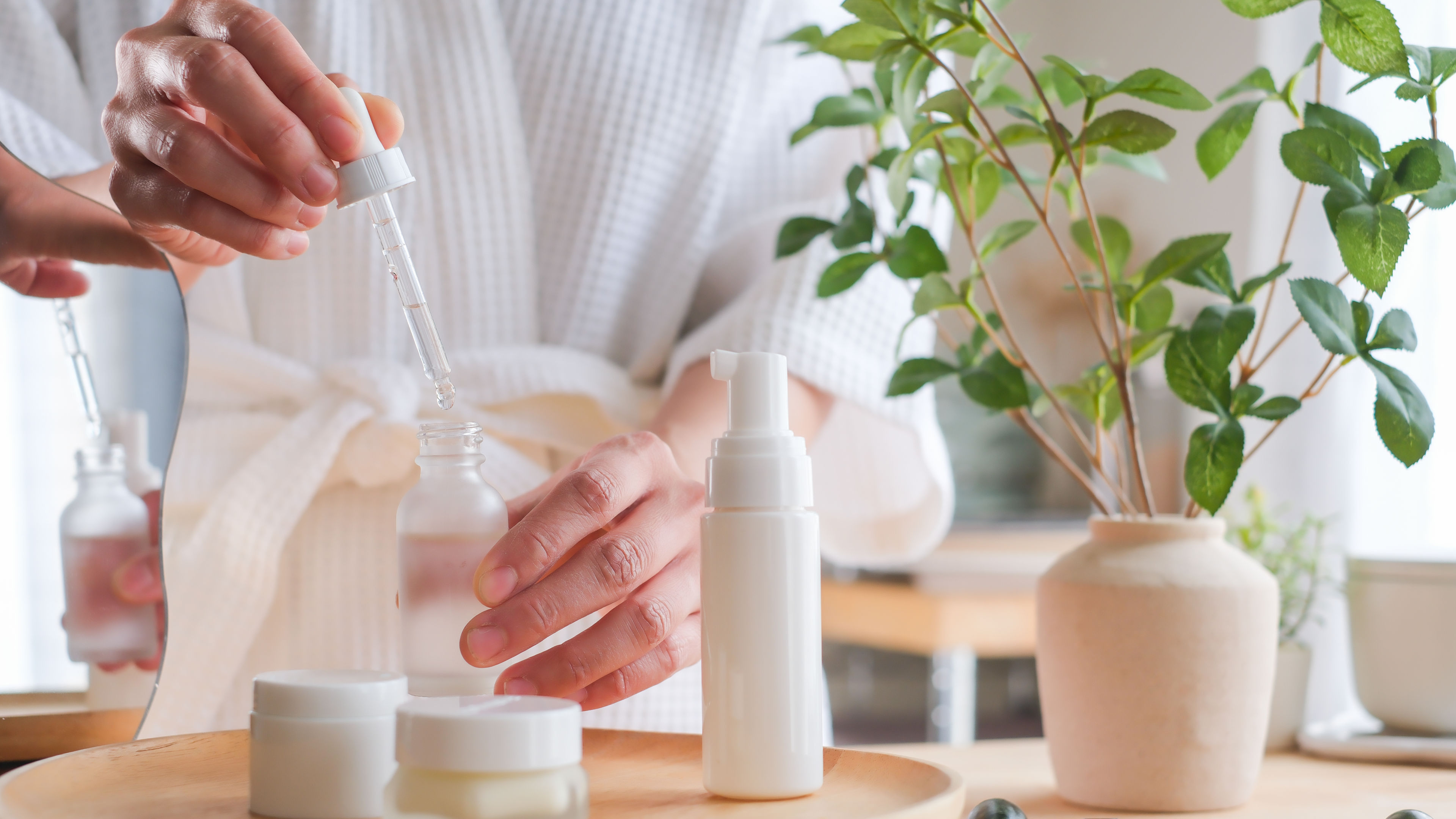 Woman applying serum