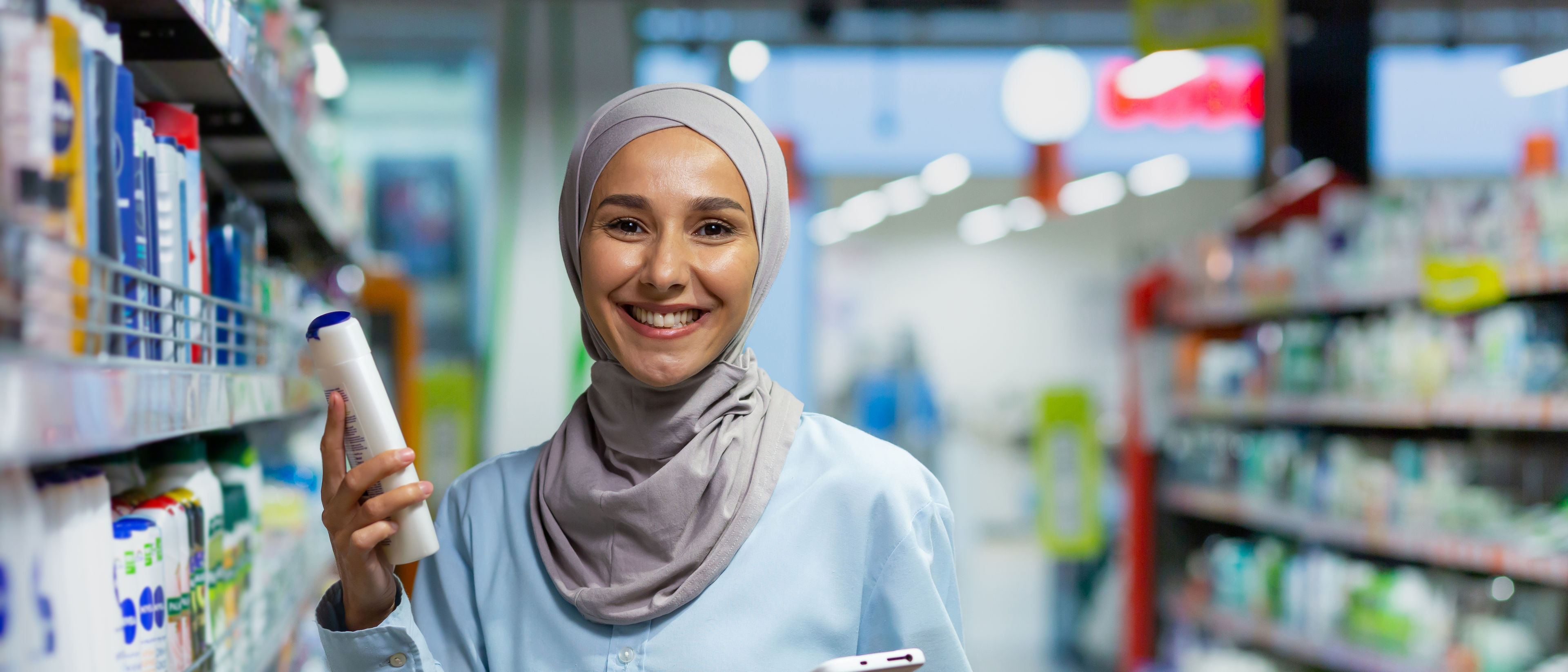 A young Arab woman purchasing health products.
